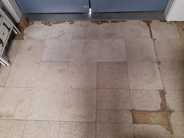 Floor tiles before refresh of Veterans Center of Citrus Heights (CA) near main hall front door